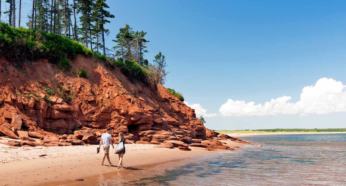 Basin Head, couple, beach, water, cliff, trees, walking